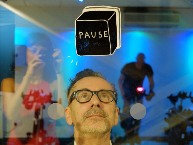 YMCA Graffiti - Pause button painted on glass