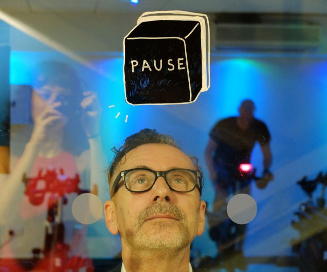 YMCA Graffiti - Pause button painted on glass