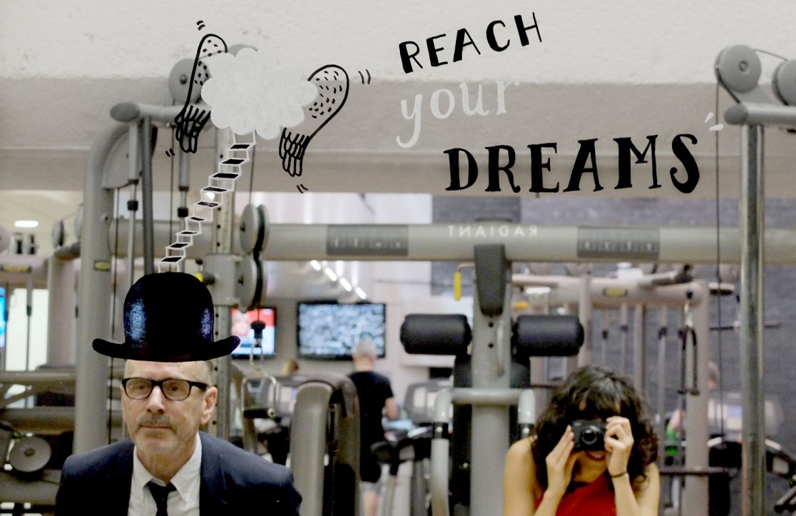 YMCA Graffiti - Reach your dreams painted on a mirror in the gym floor