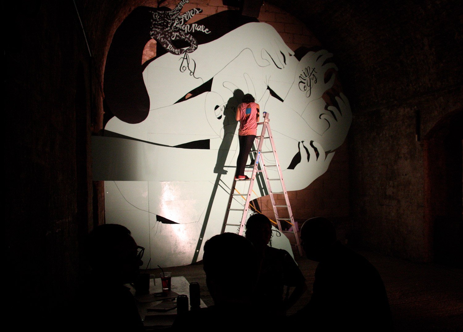 Live painting event, Cristina working on the installation Nudo