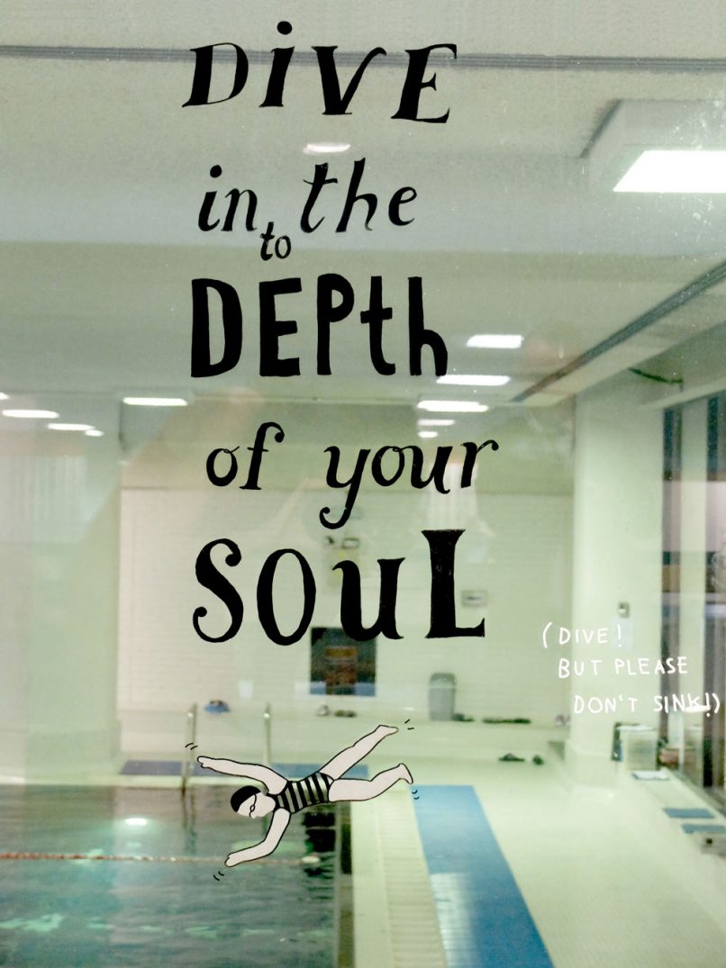 YMCA Graffiti - Dive in your Soul painted on glass in the gym pool